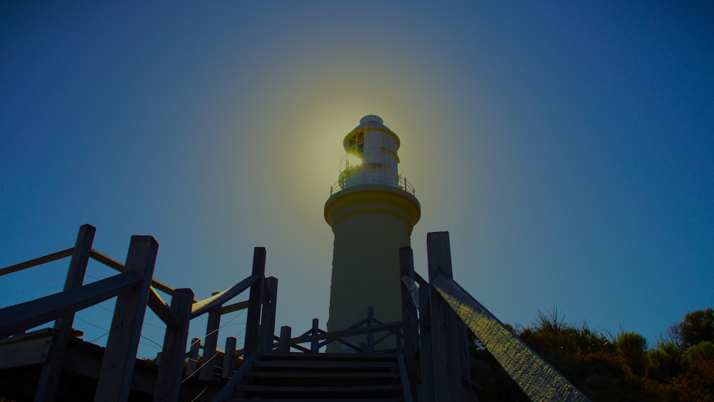 a light house with stairs leading up to it