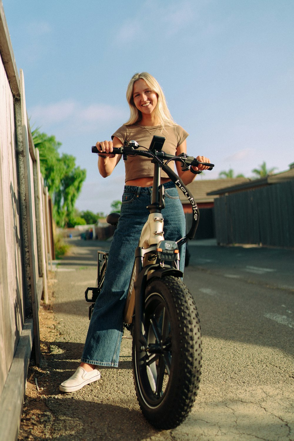 a woman sitting on top of a dirt bike