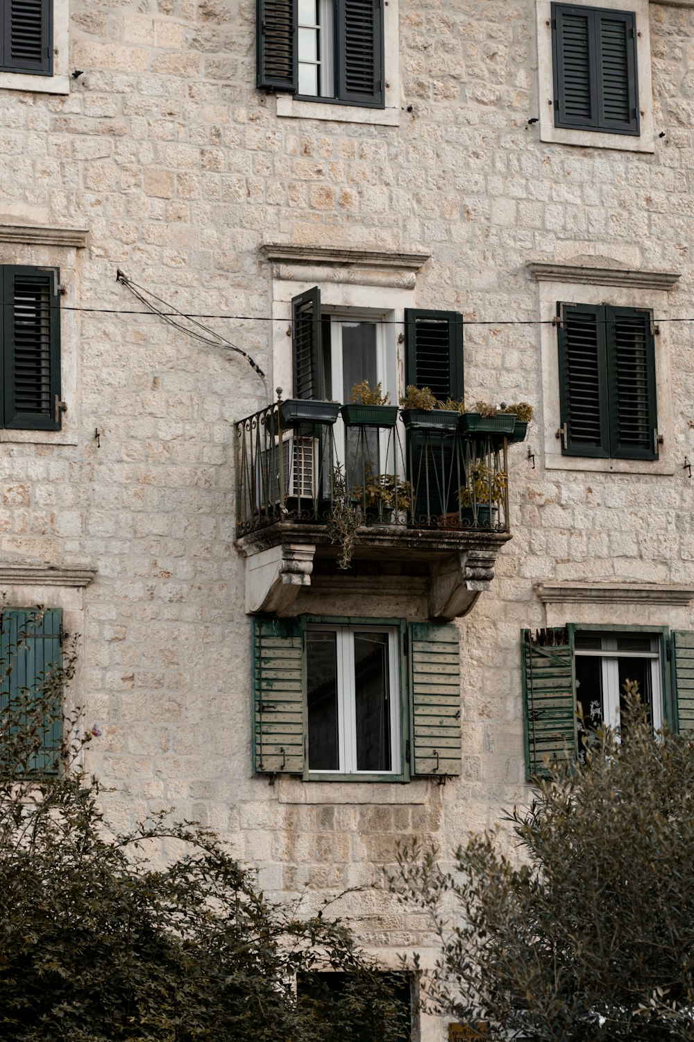 a building with two balconies and a balcony