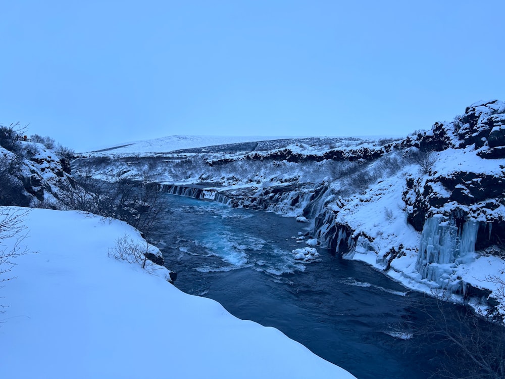 a river running through a snow covered landscape