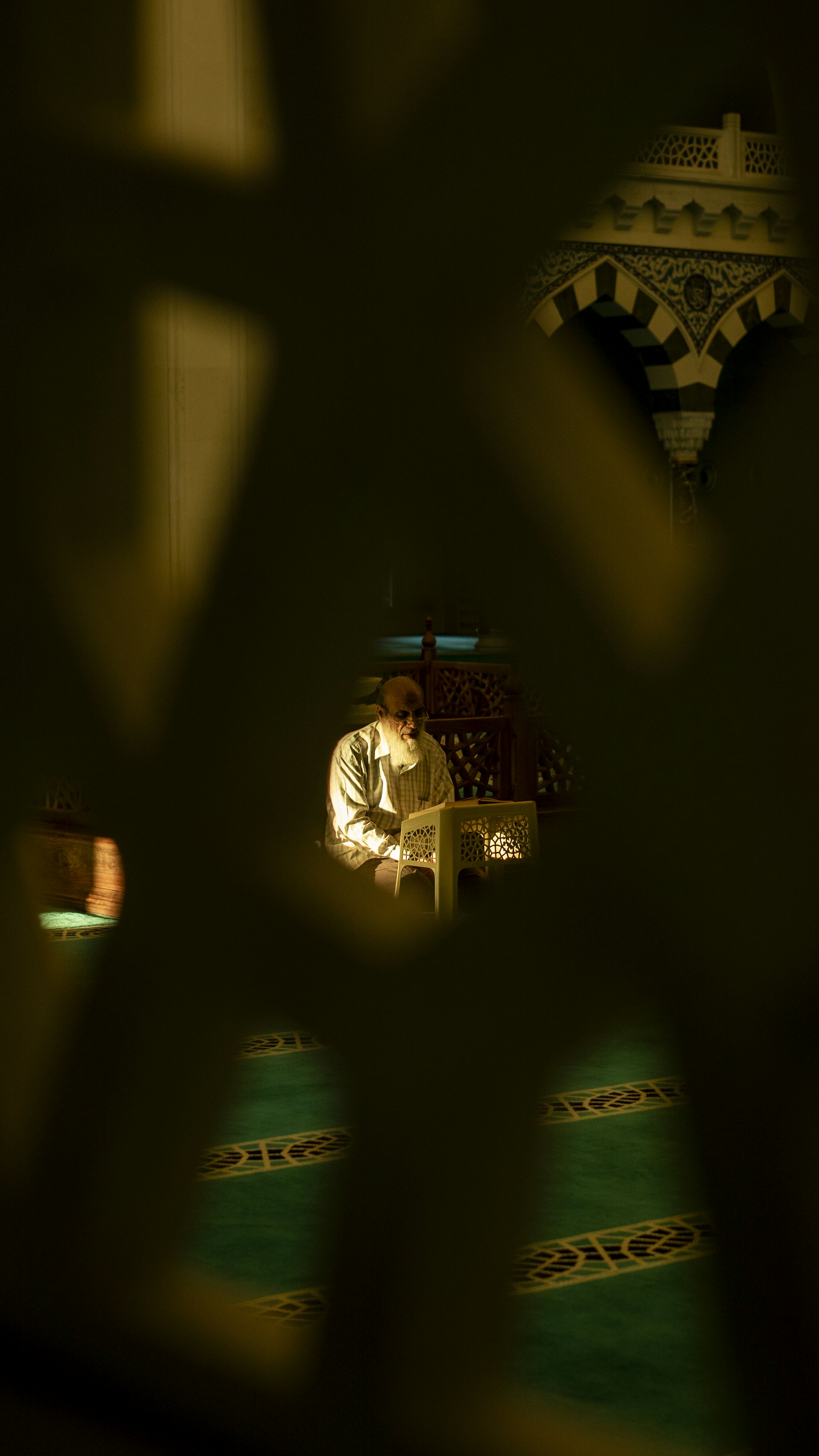 a man sitting in a chair in a room
