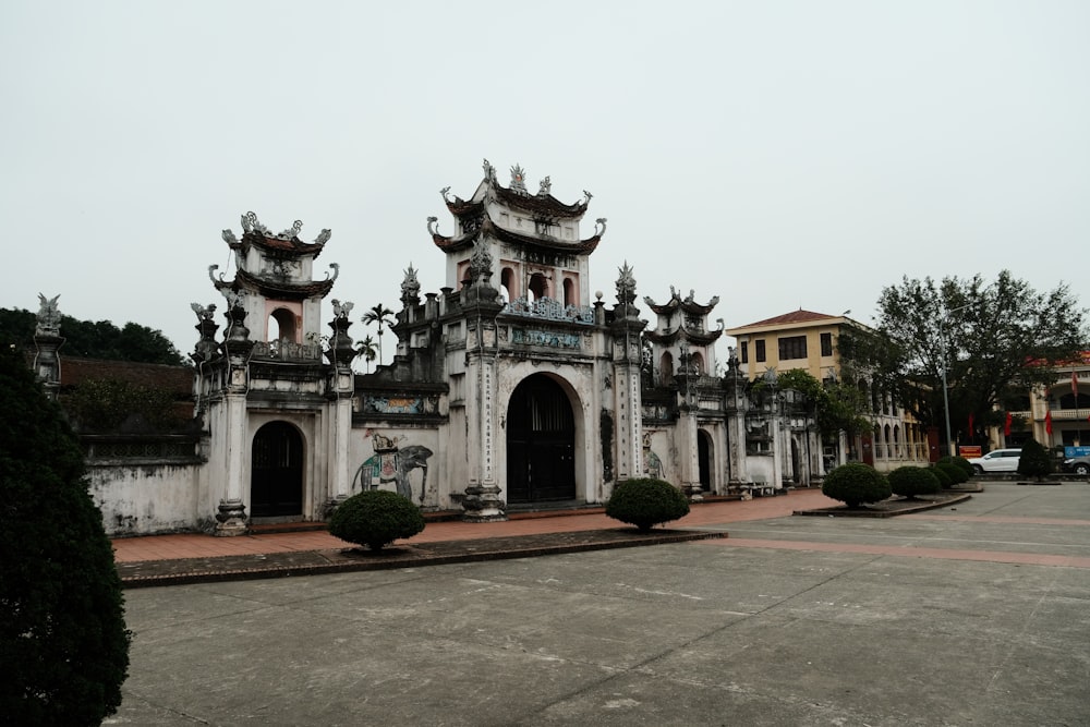 an old building with a lot of statues on top of it