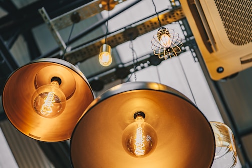 a couple of lights that are hanging from a ceiling
