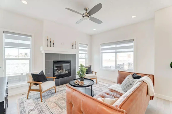 a living room filled with furniture and a fire place
