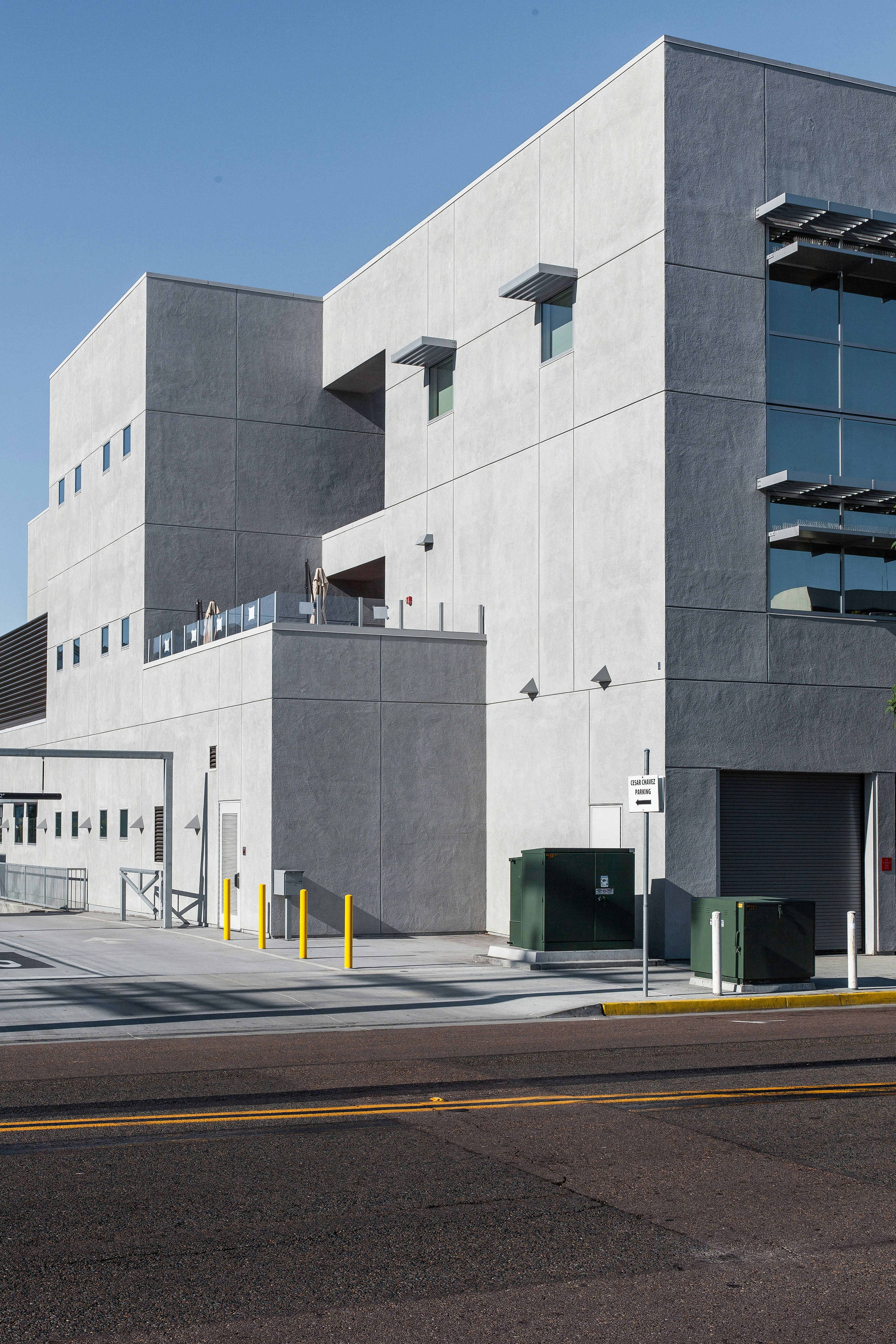 Government building exterior with clear blue sky, modern architecture, professional appearance