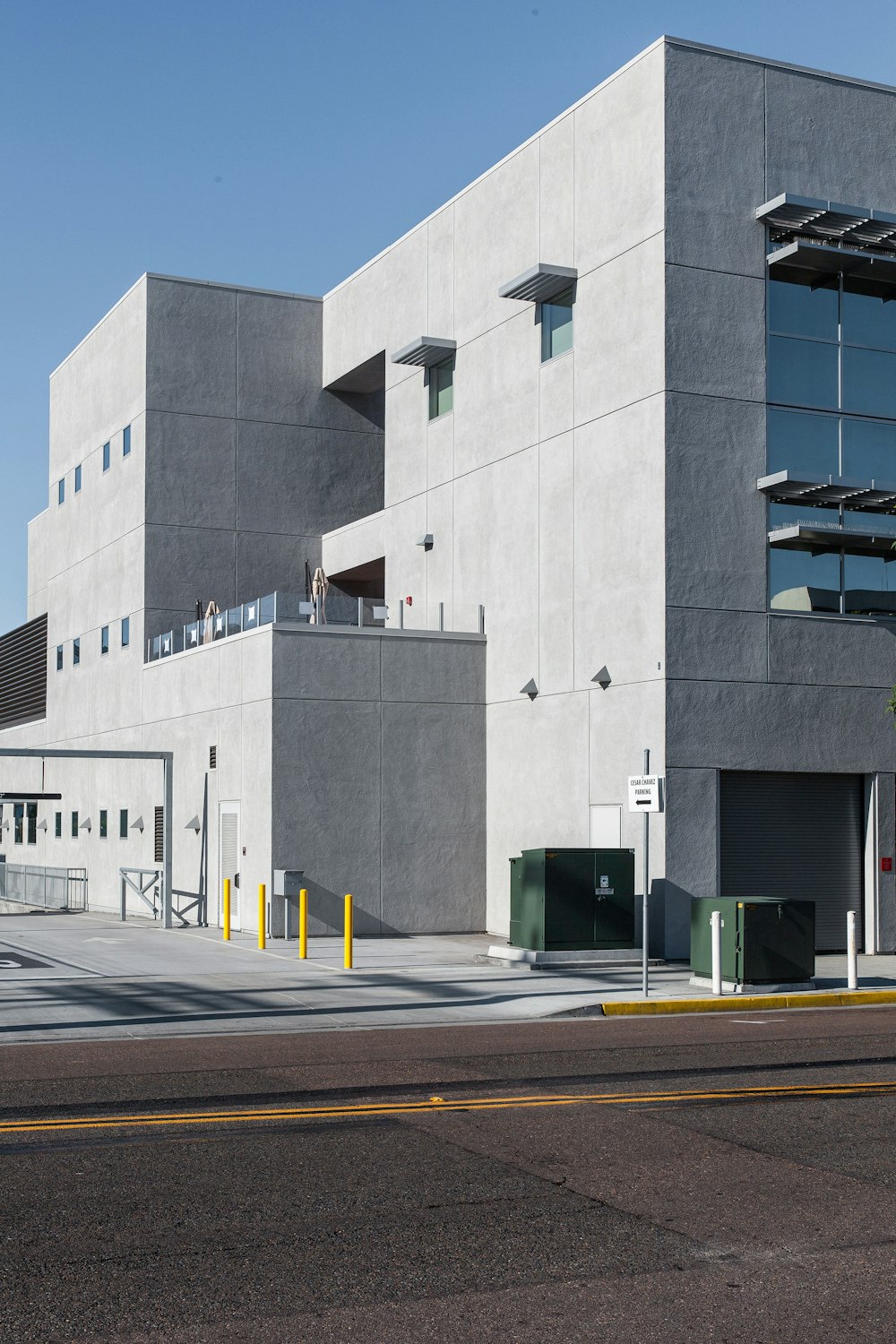 a large gray building sitting on the side of a road