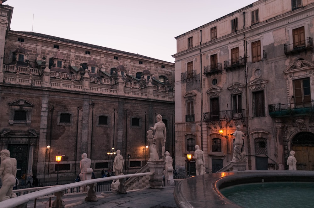 a group of statues in front of a building