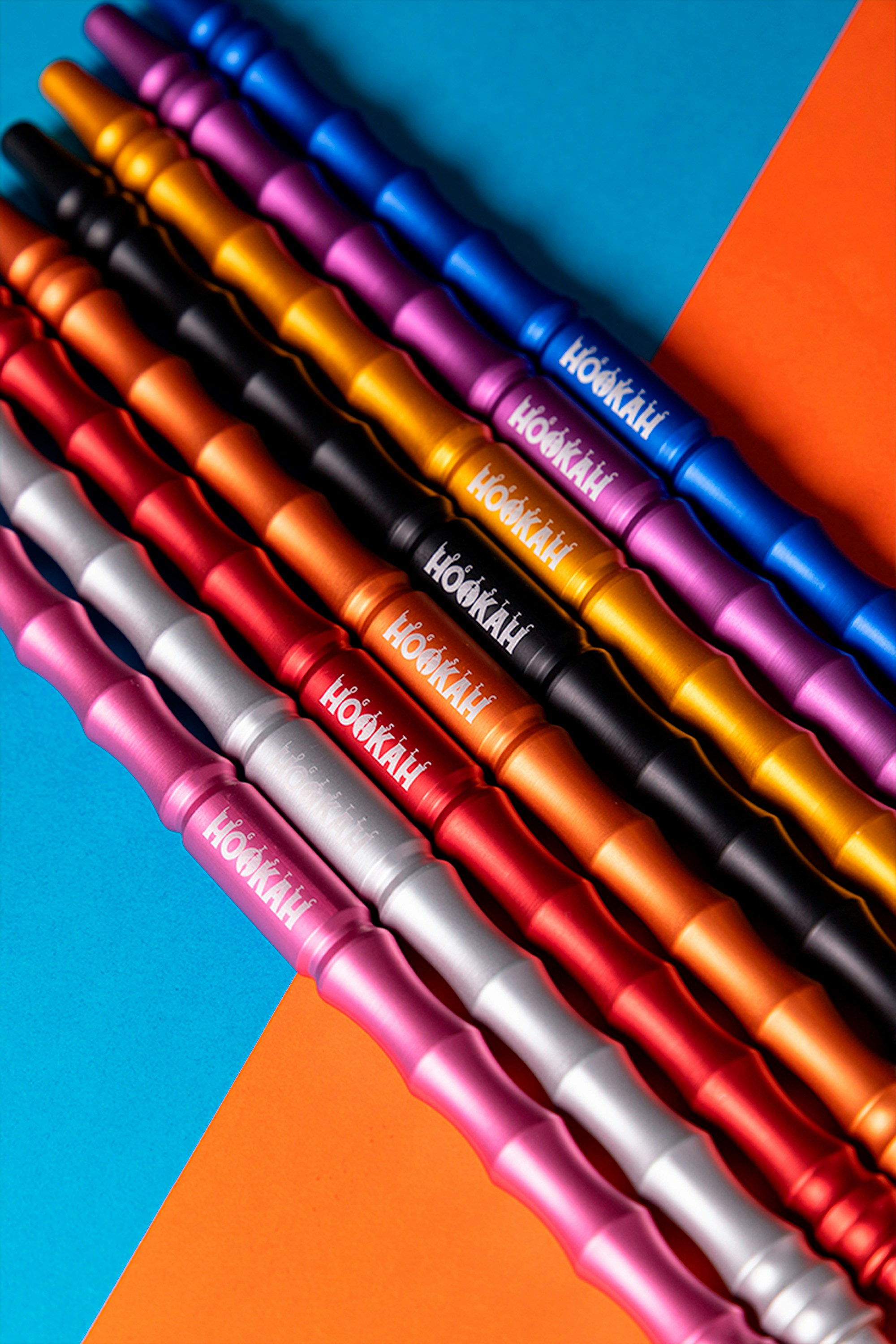 a group of pens sitting on top of each other