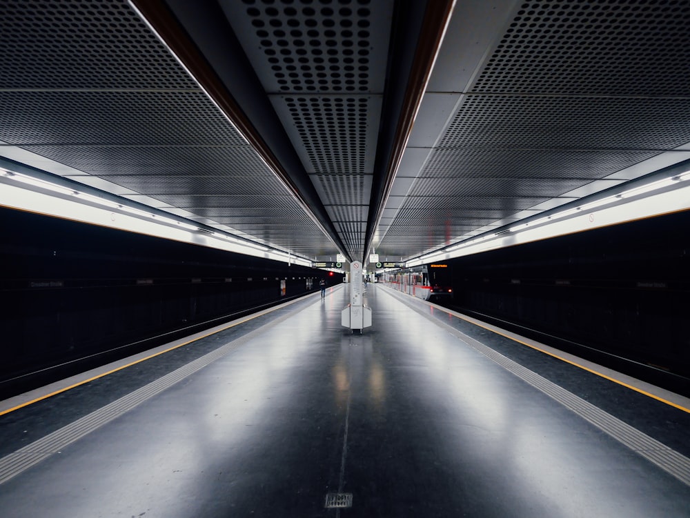 a train station with a long line of train tracks