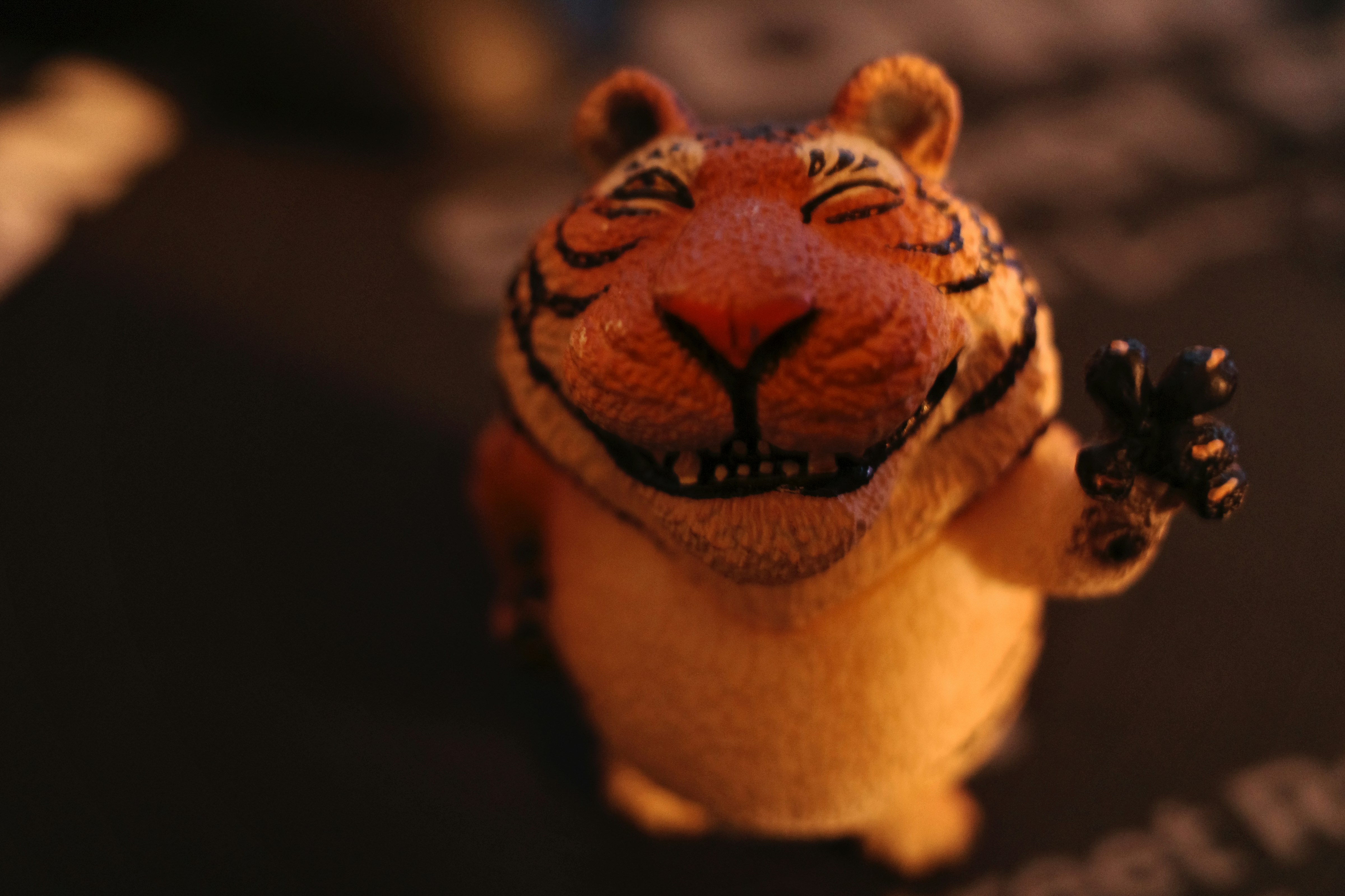 a close up of a toy tiger on a table