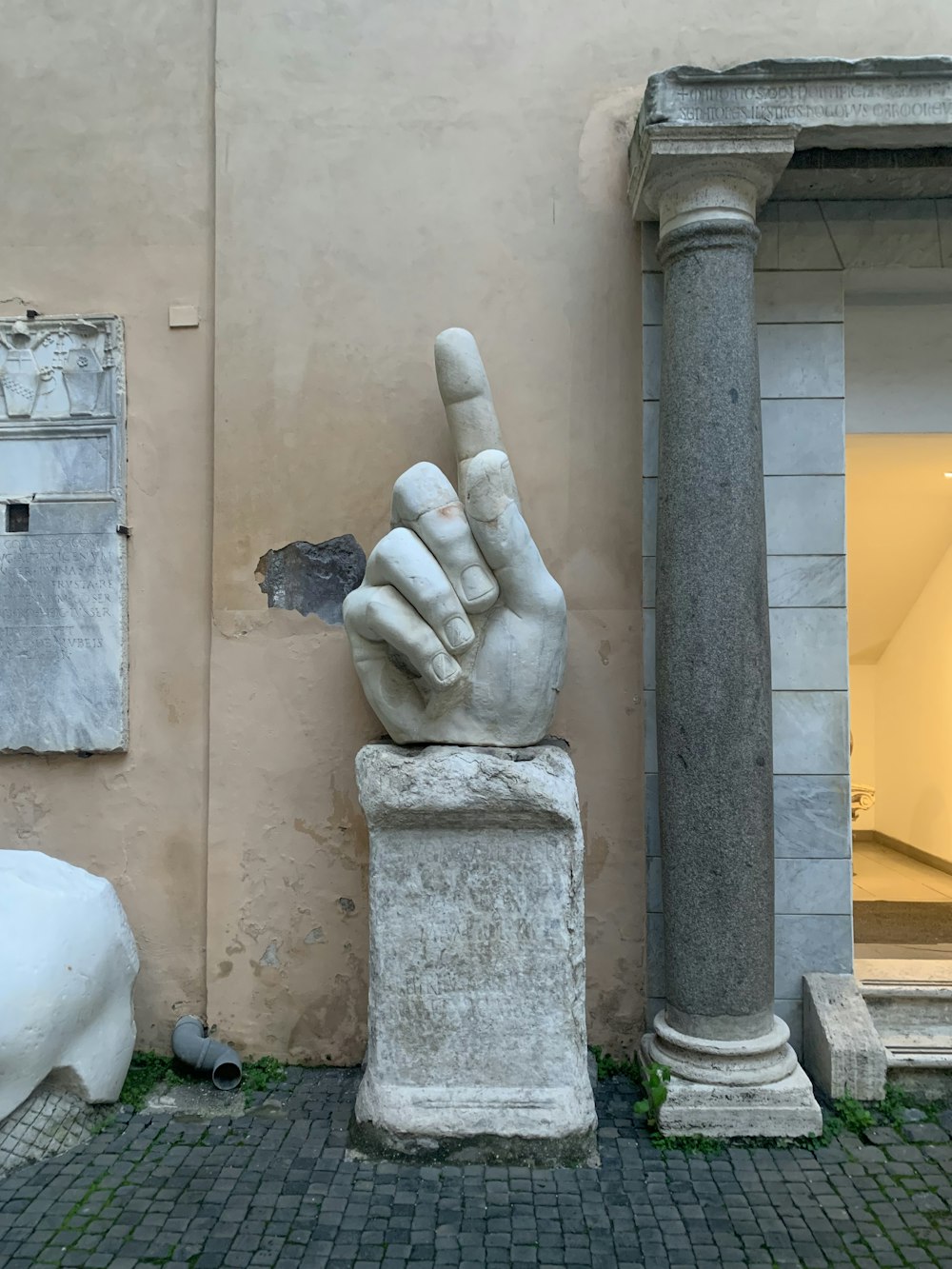 a statue of a hand making a peace sign