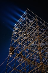 a large metal structure with lights on top of it