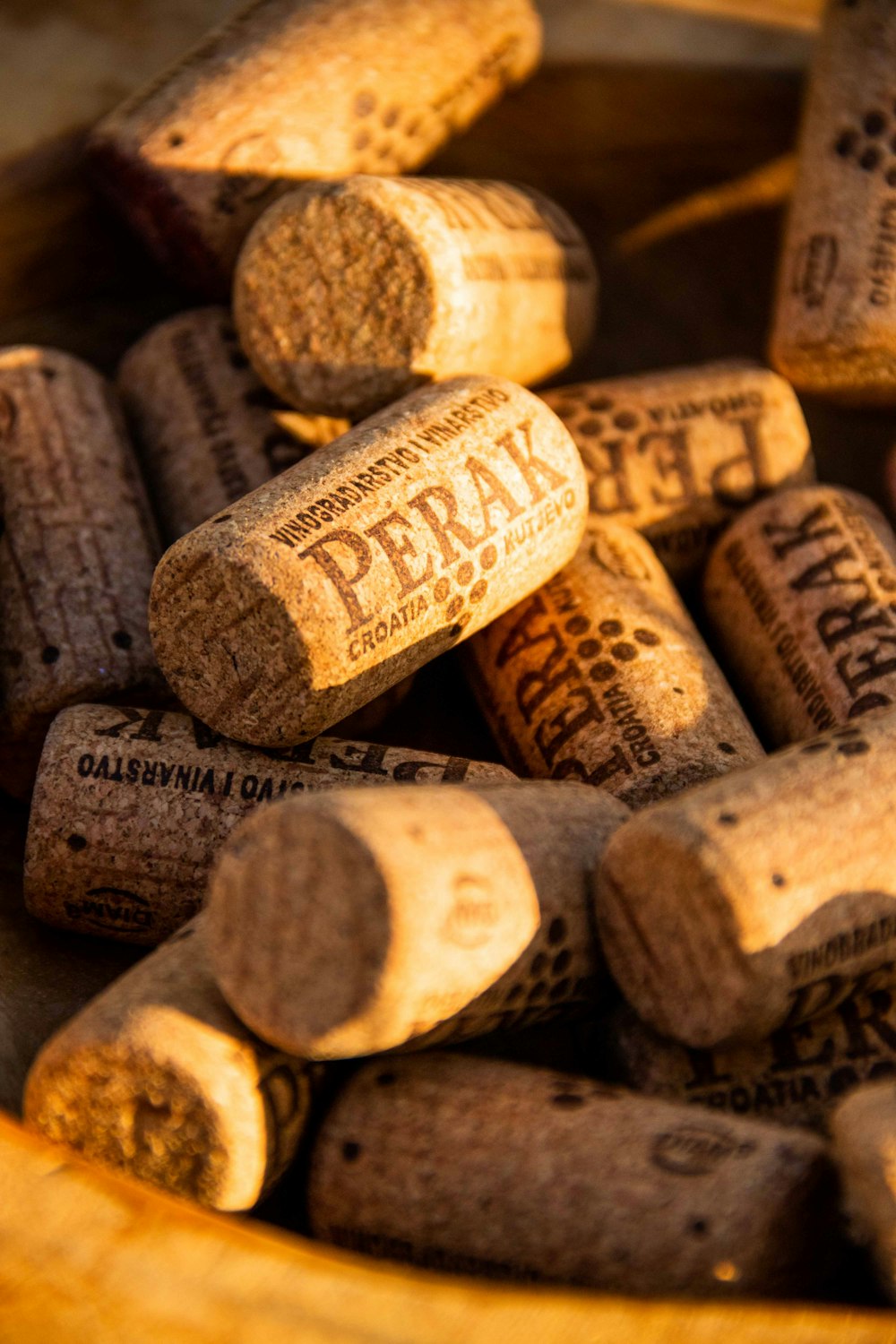 a bunch of wine corks sitting in a bowl