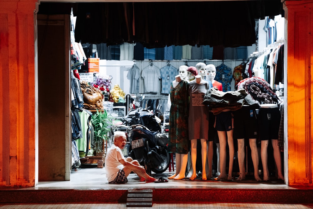 a group of mannequins in a store window