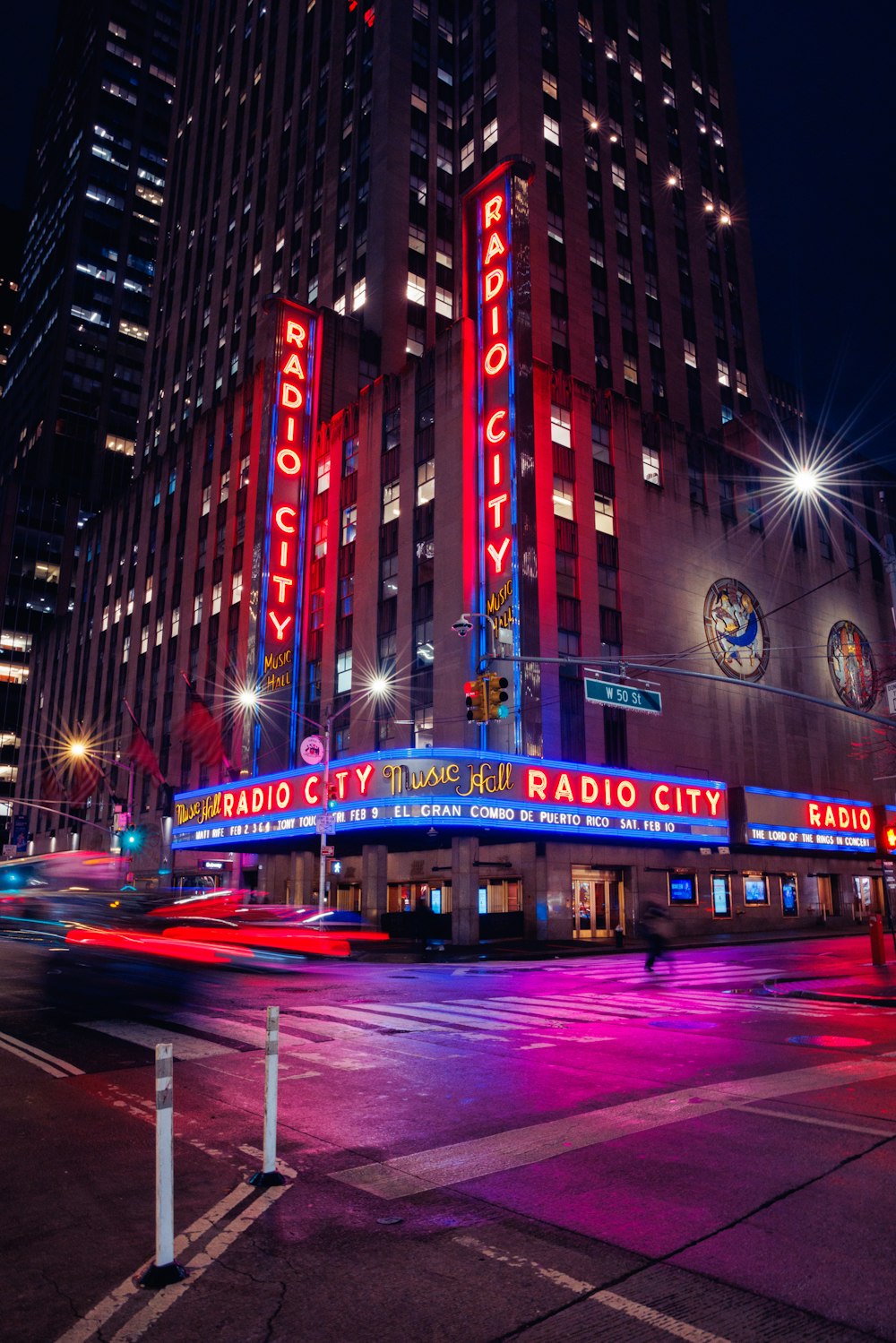 the radio city radio city building lit up at night