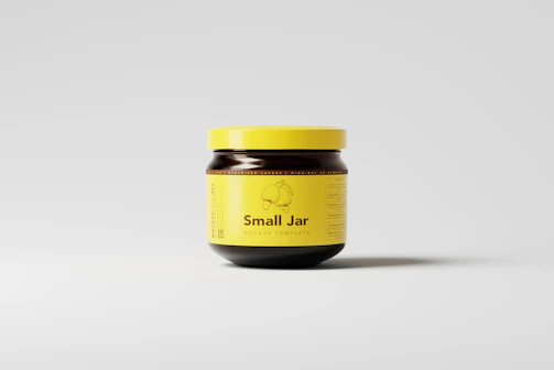 a jar of small jar jam on a white surface