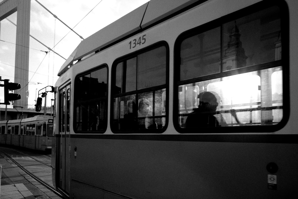 a black and white photo of a train at a train station