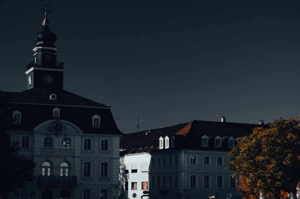 a large white building with a clock tower