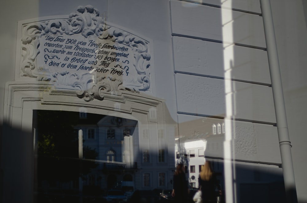 a reflection of a building in a window