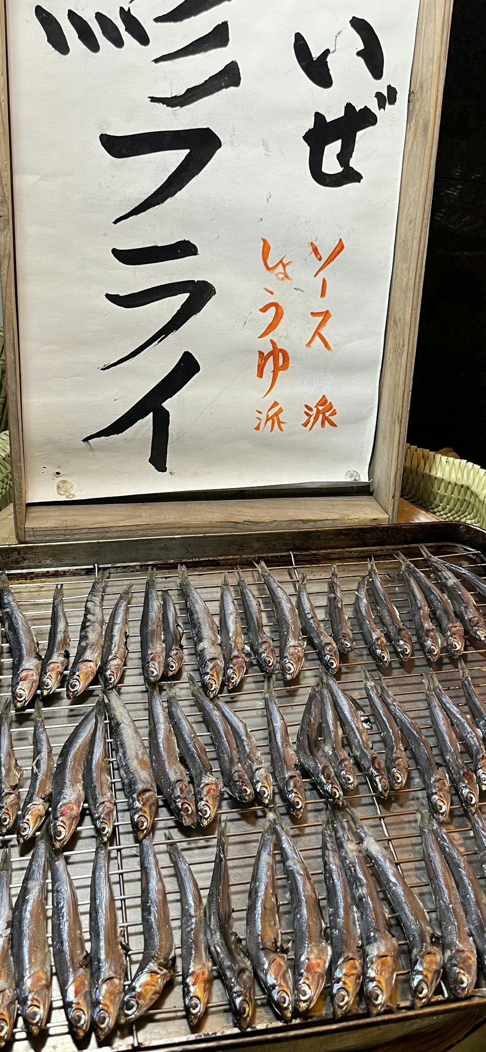 a bunch of fish that are on a grill