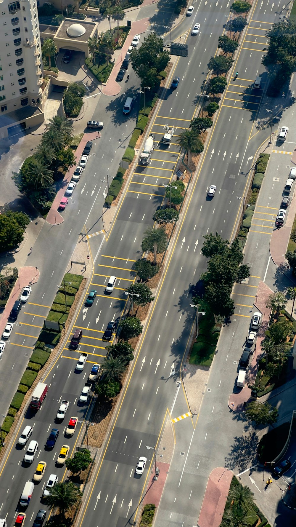 an aerial view of a city street with many cars