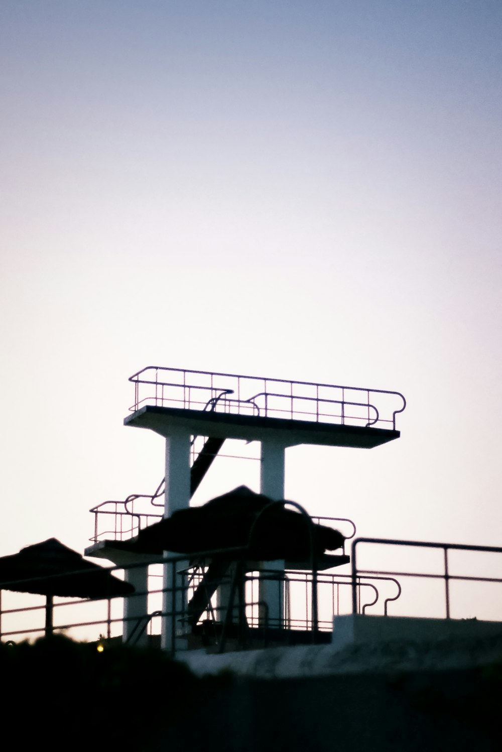 a jetliner flying over the top of a tall building