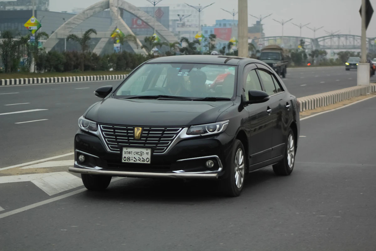 Black Toyota Premio on the road