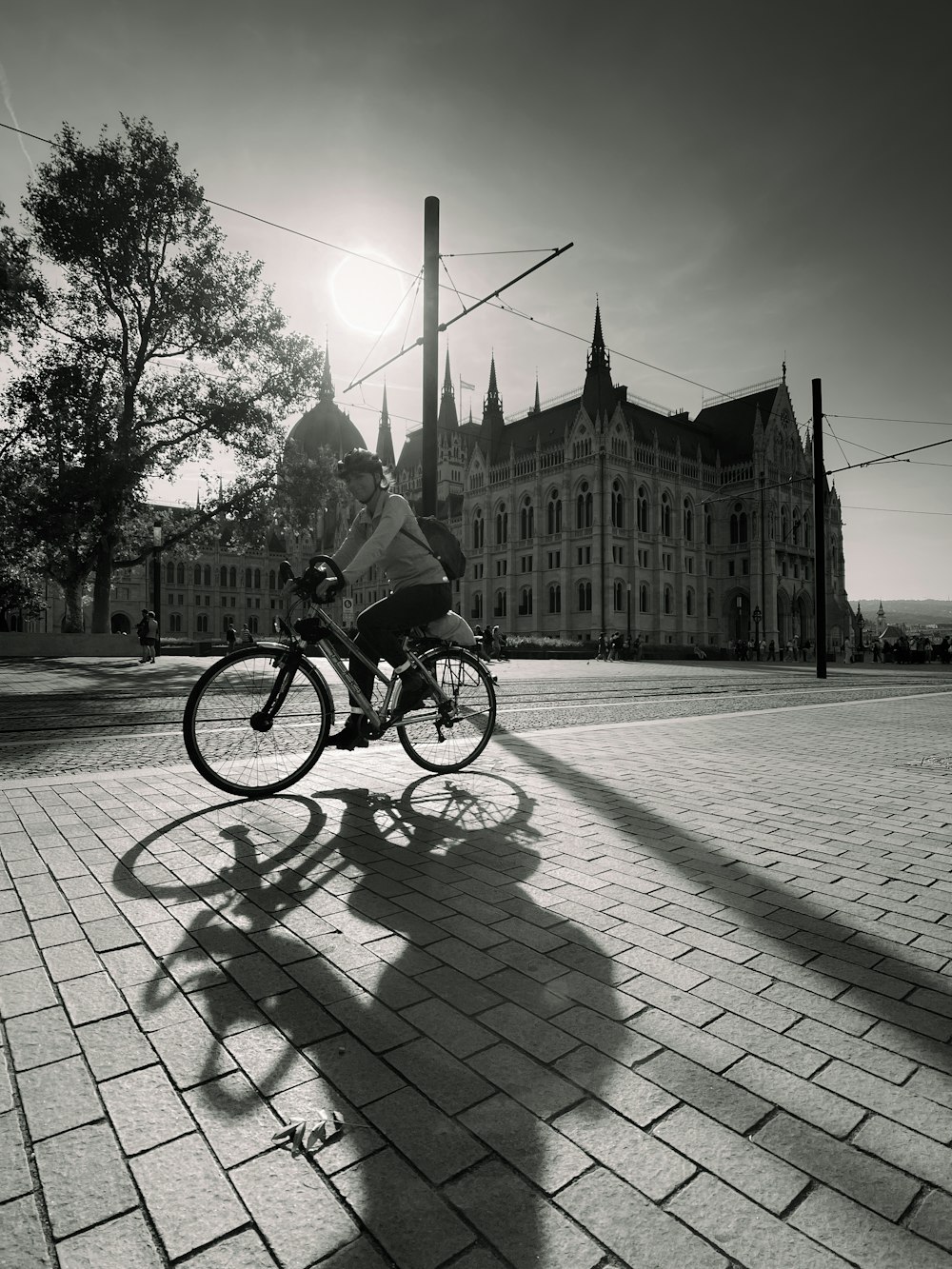 a person riding a bike on a brick road