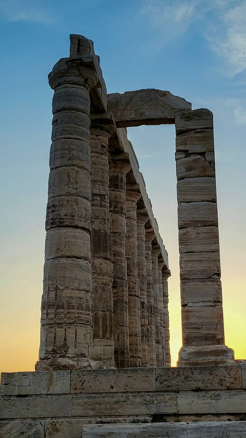 a large stone structure sitting on top of a field