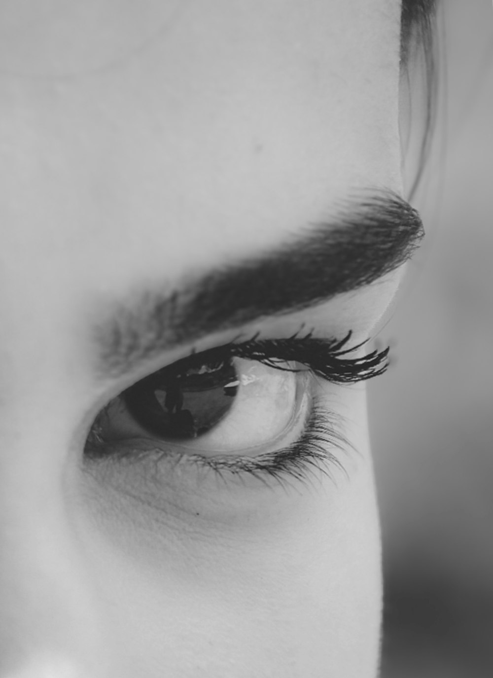 a close up of a person's eye with long lashes