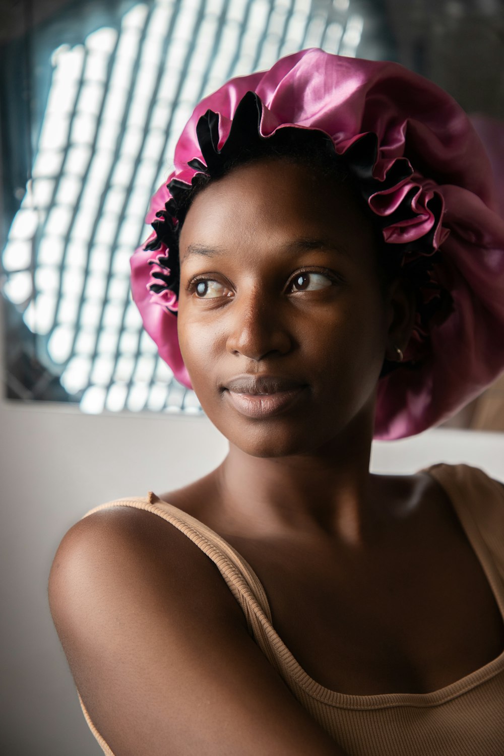 a woman with a pink hat on her head