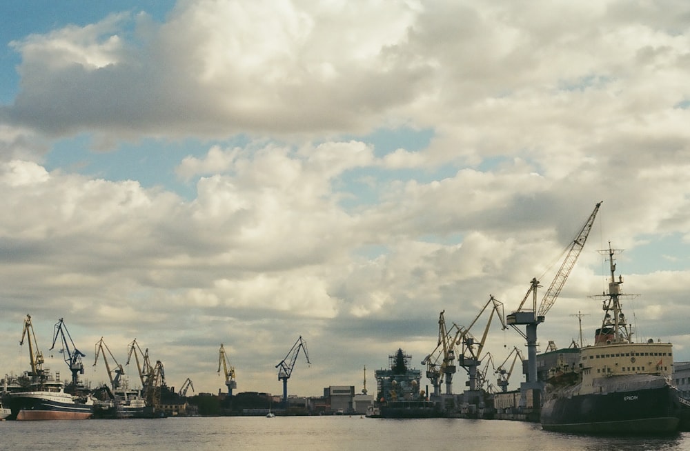 a harbor filled with lots of boats under a cloudy sky