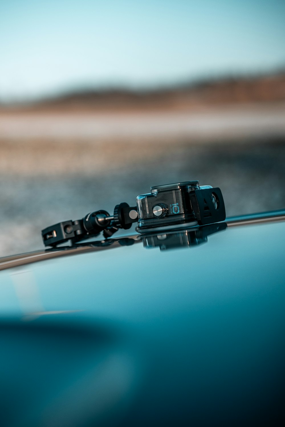 a close up of a camera attached to the hood of a car
