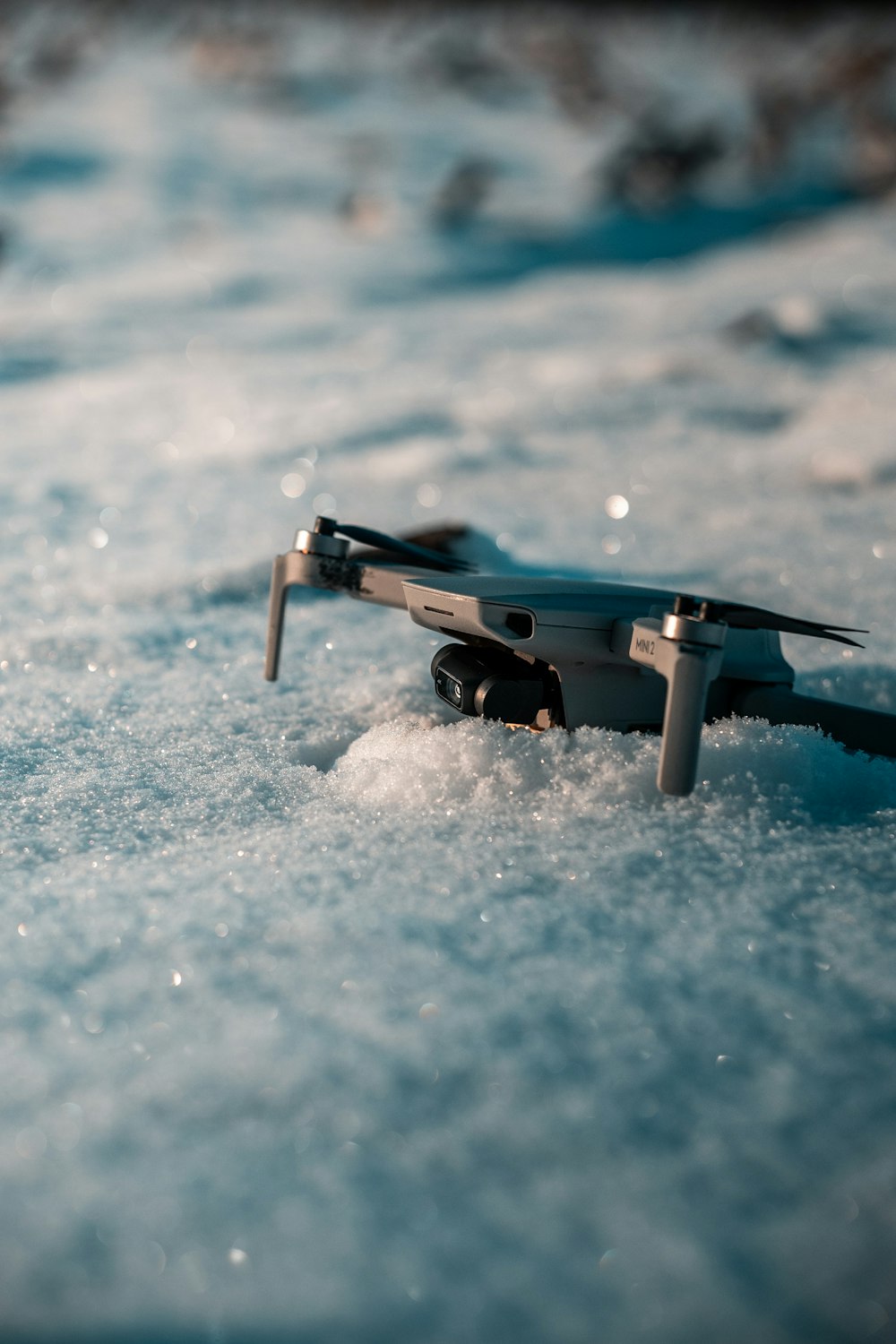 a close up of a toy airplane in the snow