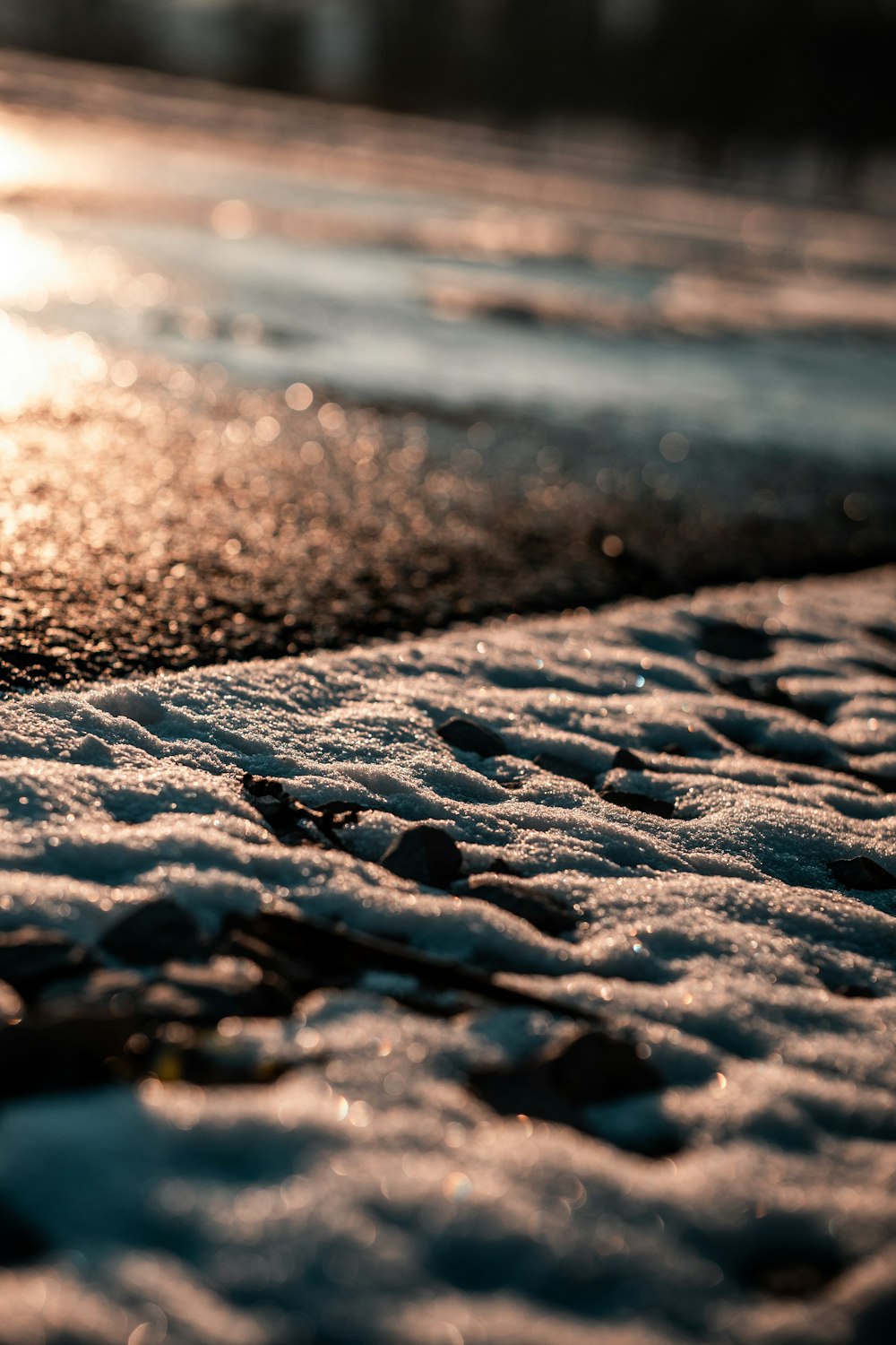 a close up of a street with snow on the ground