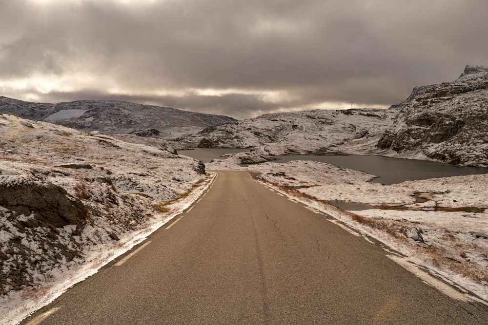 a road in the middle of a snowy mountain range