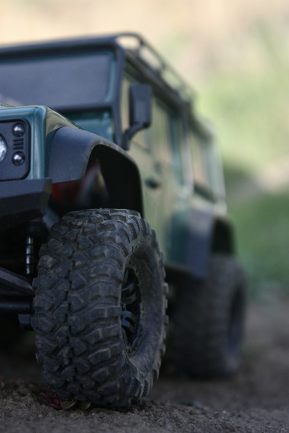 a close up of a toy truck on the ground