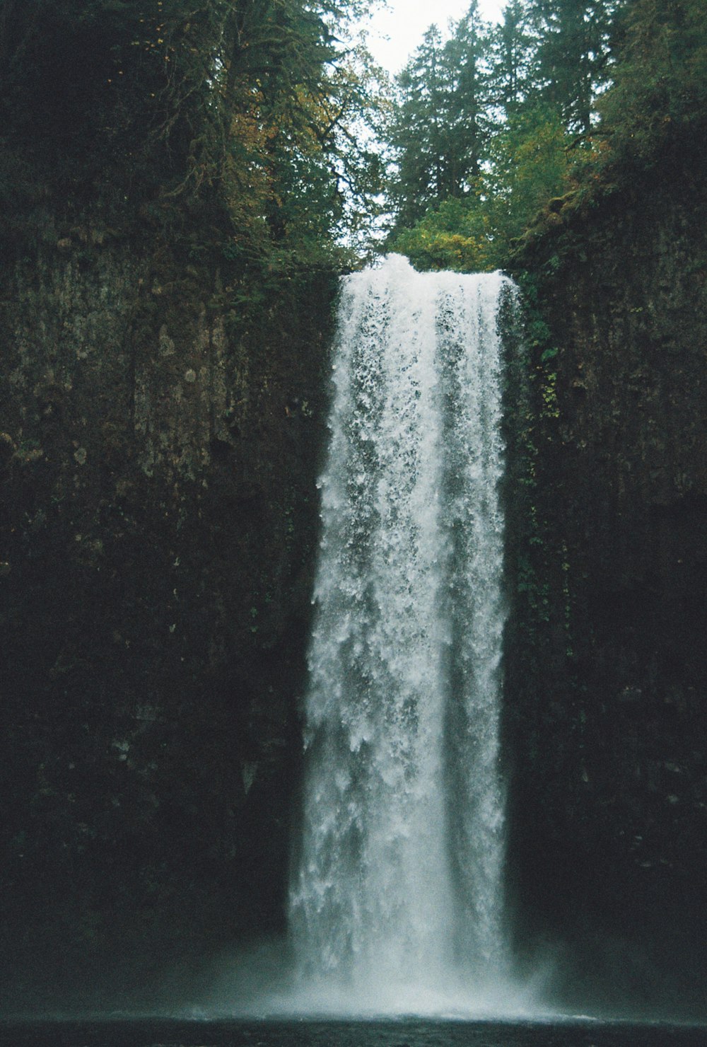 a large waterfall with water cascading over it