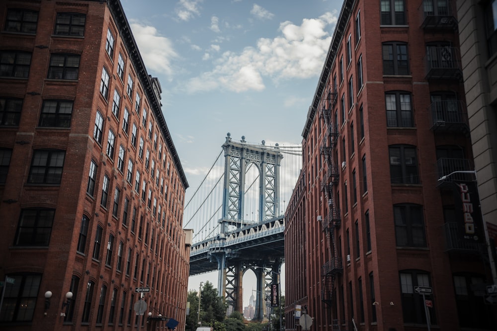 a view of a bridge from between two buildings