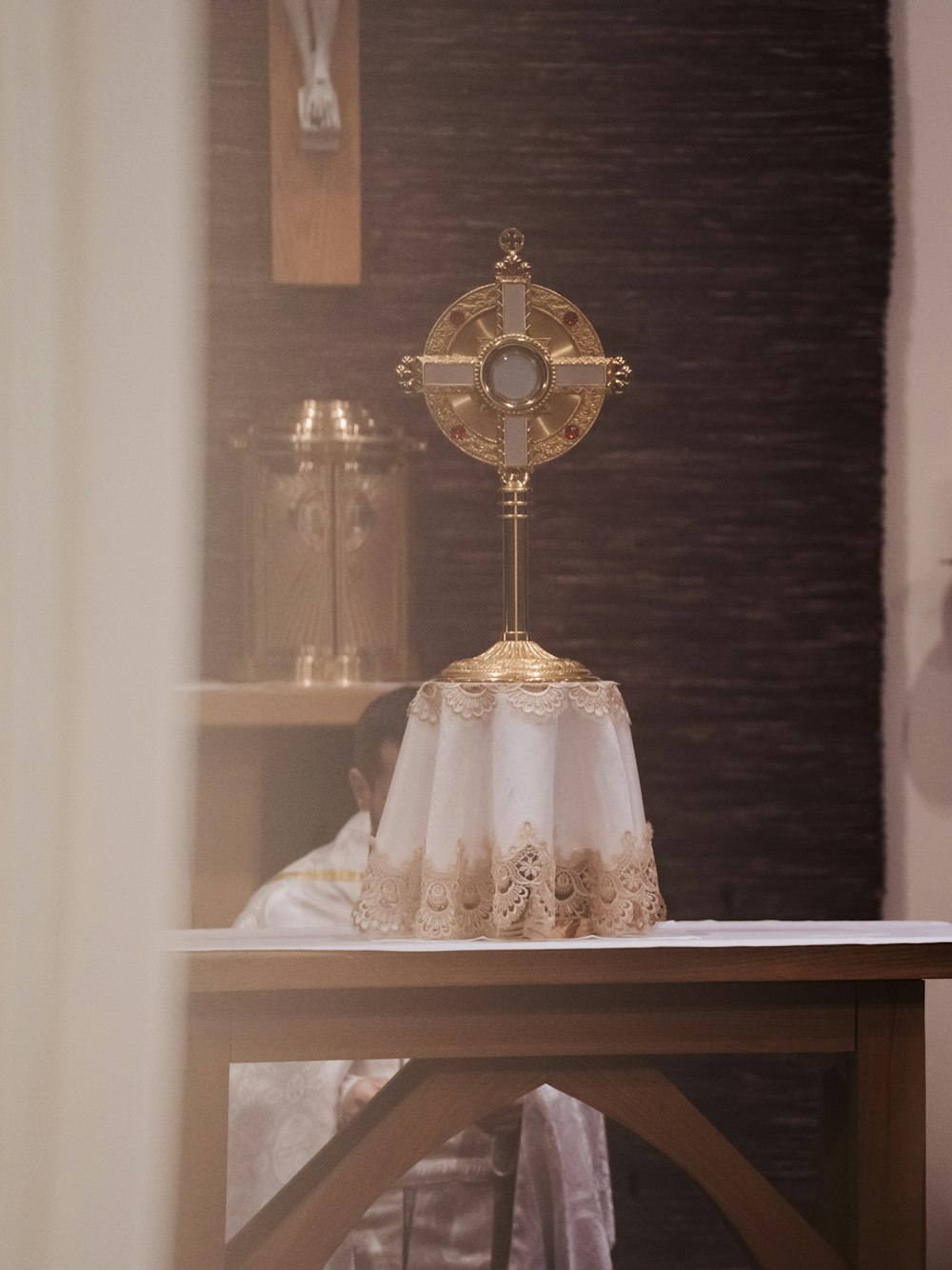 a cross on top of a table in a church