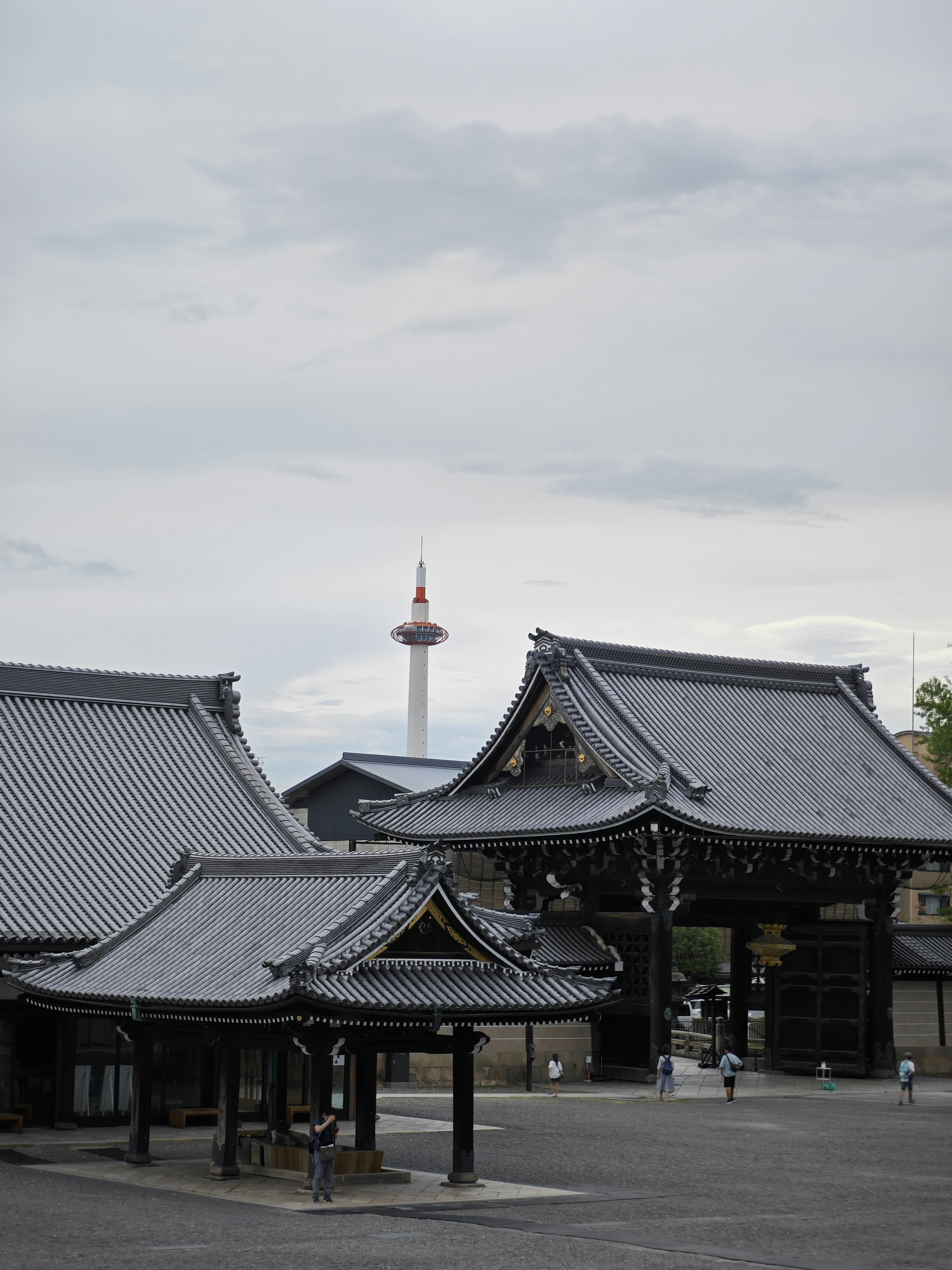 a large building with a tower in the background
