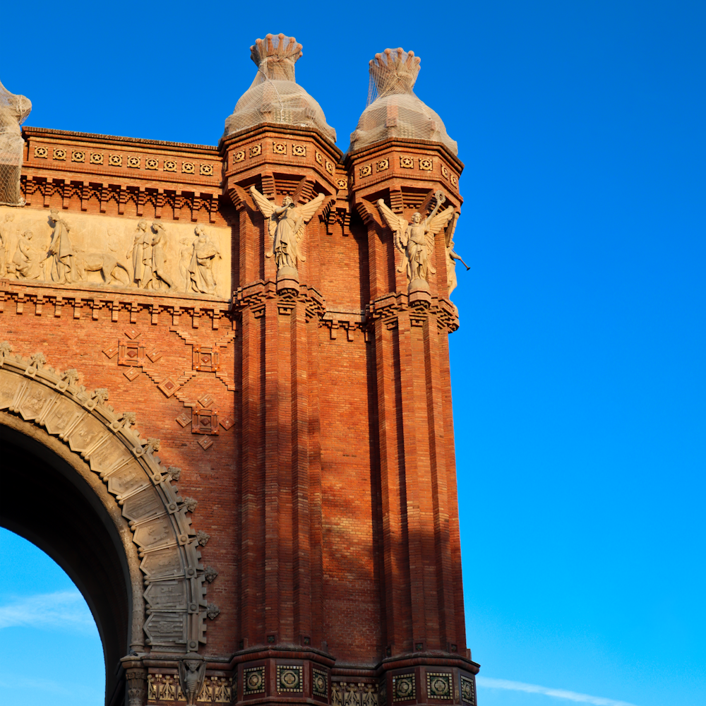 a tall brick building with a clock on it's side