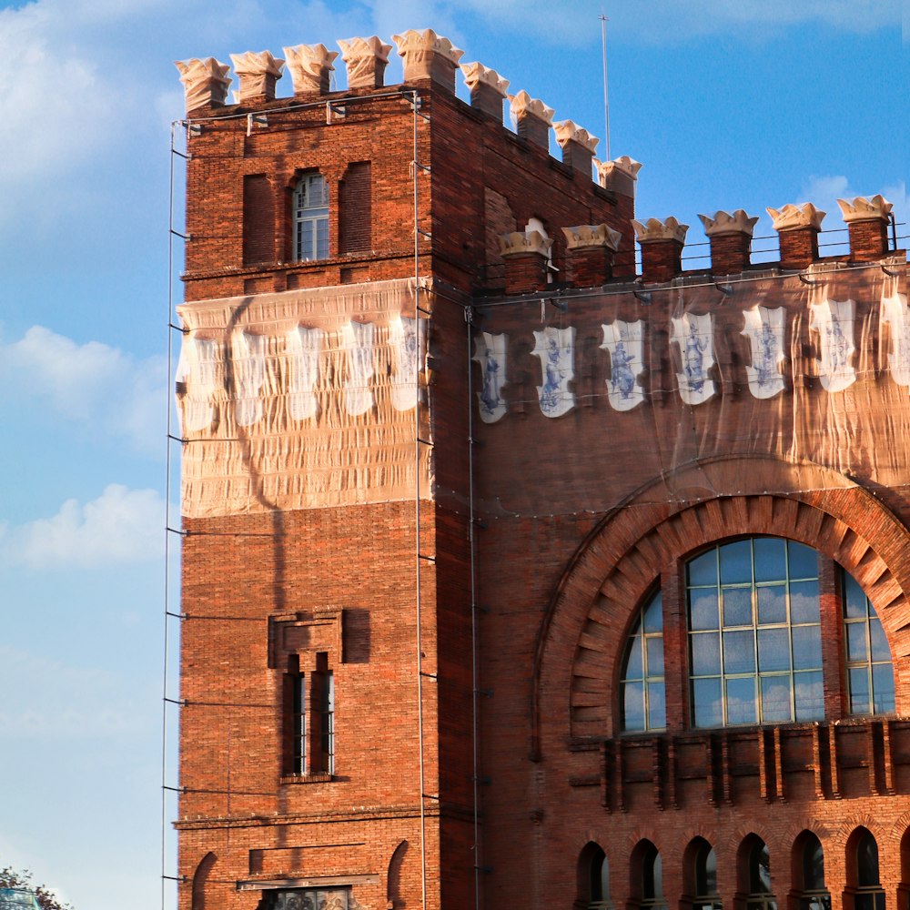 a tall brick building with a clock tower