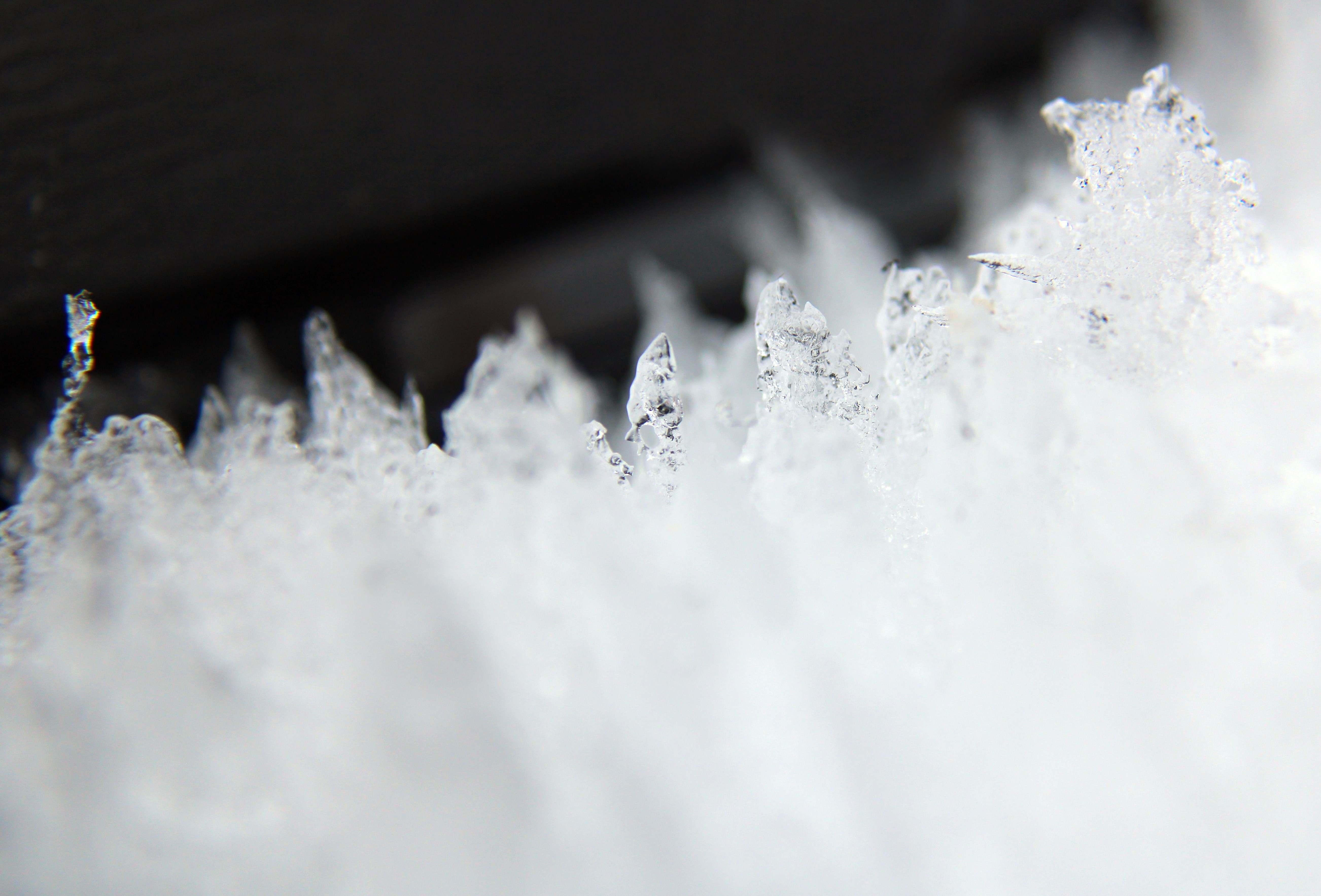 a close up of snow crystals on a table