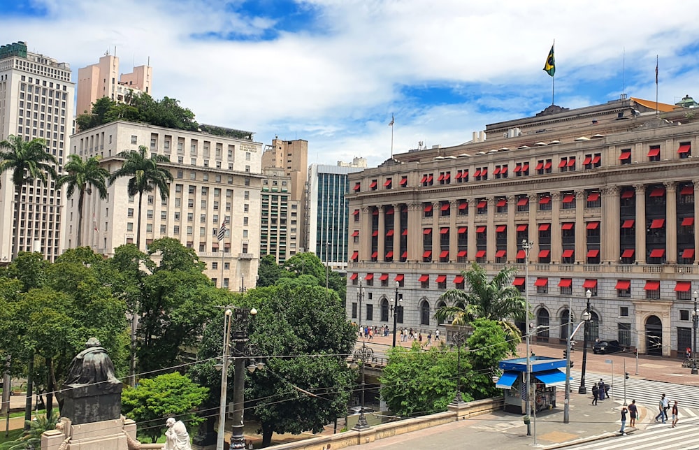 a large building in a city surrounded by tall buildings