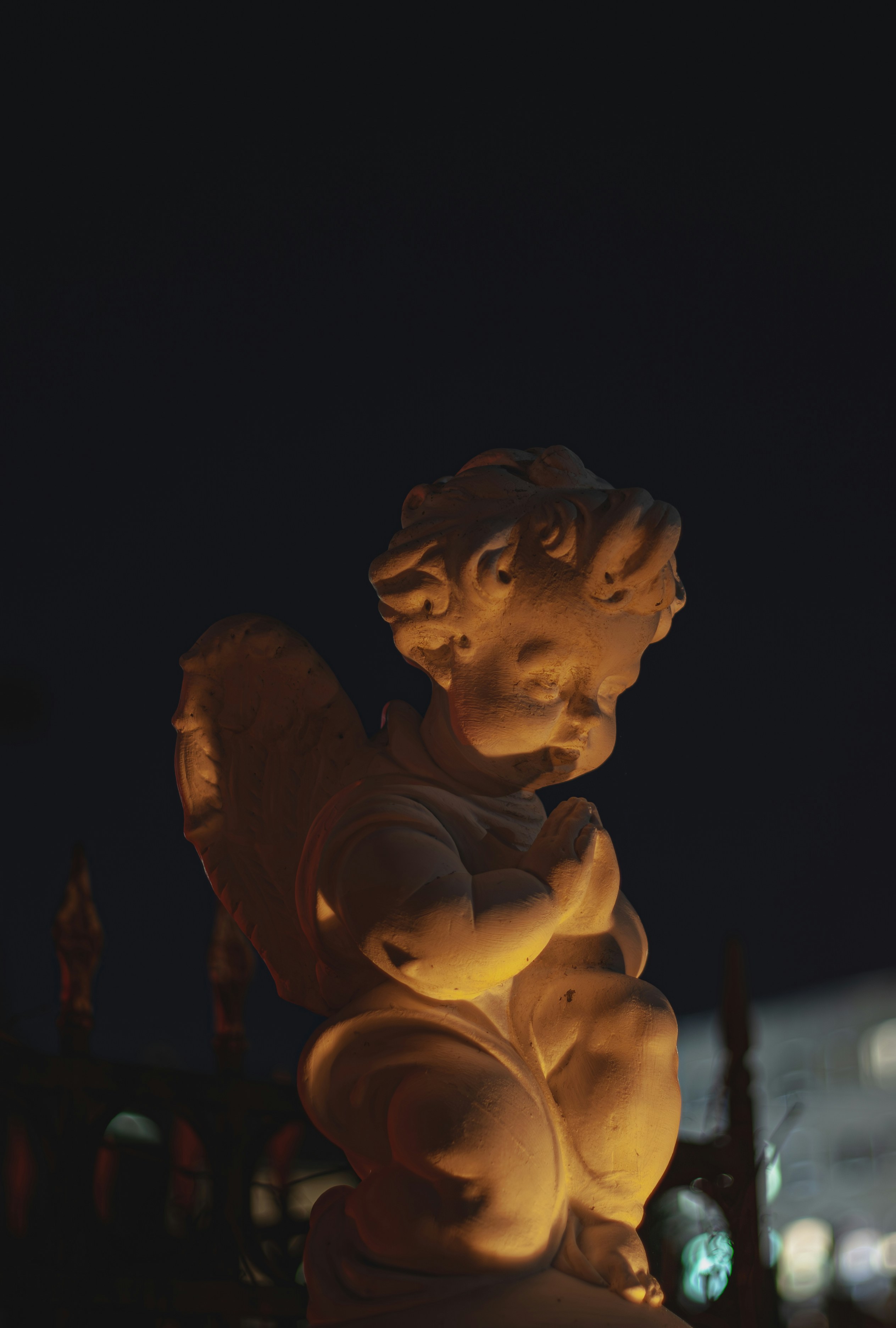 a statue of a child holding a teddy bear
