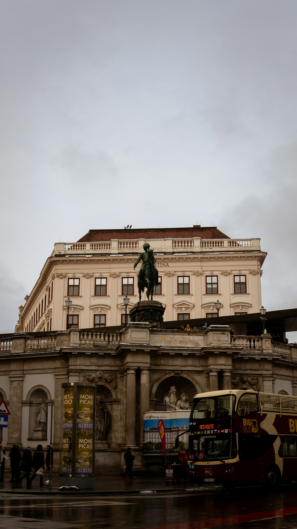 a large building with a statue on top of it