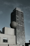 a tall building sitting next to a tall building