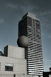 a tall building sitting next to a tall building