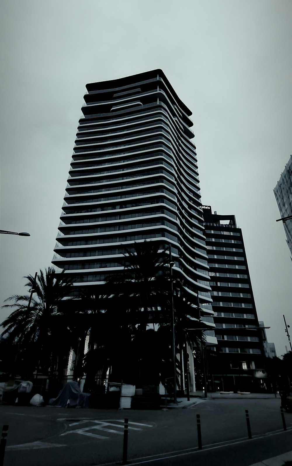 a black and white photo of a tall building